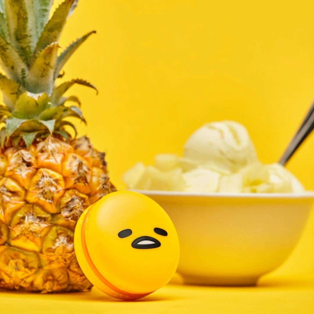 The Crème Shop X Sanrio Collabs Gudetama Macaron Lip Balm - Pineapple Sherbert The Crème Shop X Sanrio Collabs Gudetama Macaron Lip Balm - Pineapple Sherbert