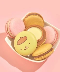 The Crème Shop X Sanrio Pompompurin Holiday Macaron Lip Balm - Caramel Pudding Collabs